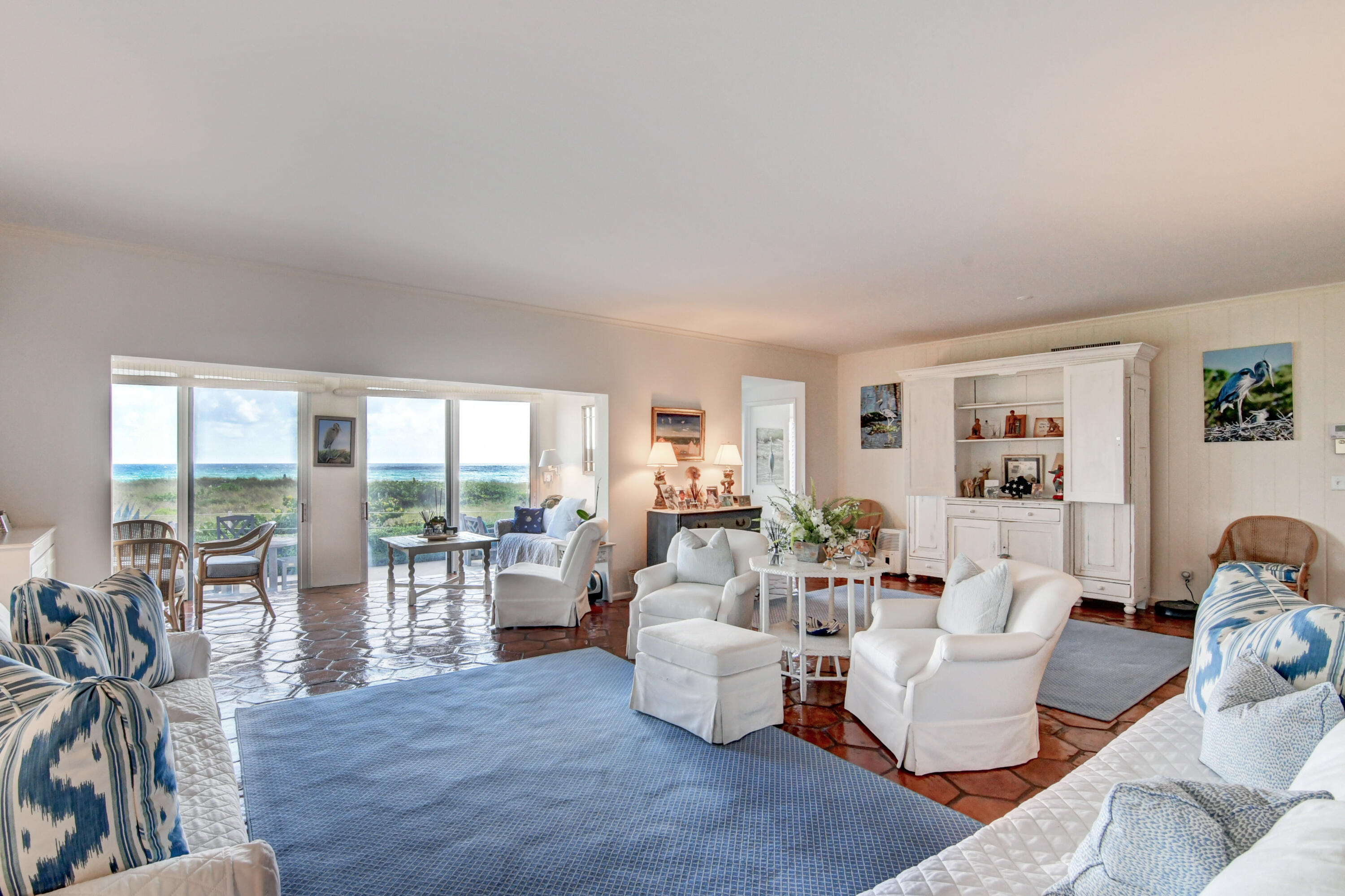 801 North Ocean Boulevard Delray Beach, FL 33483 - Photo 7 of 37 a living room with fireplace furniture and a large window