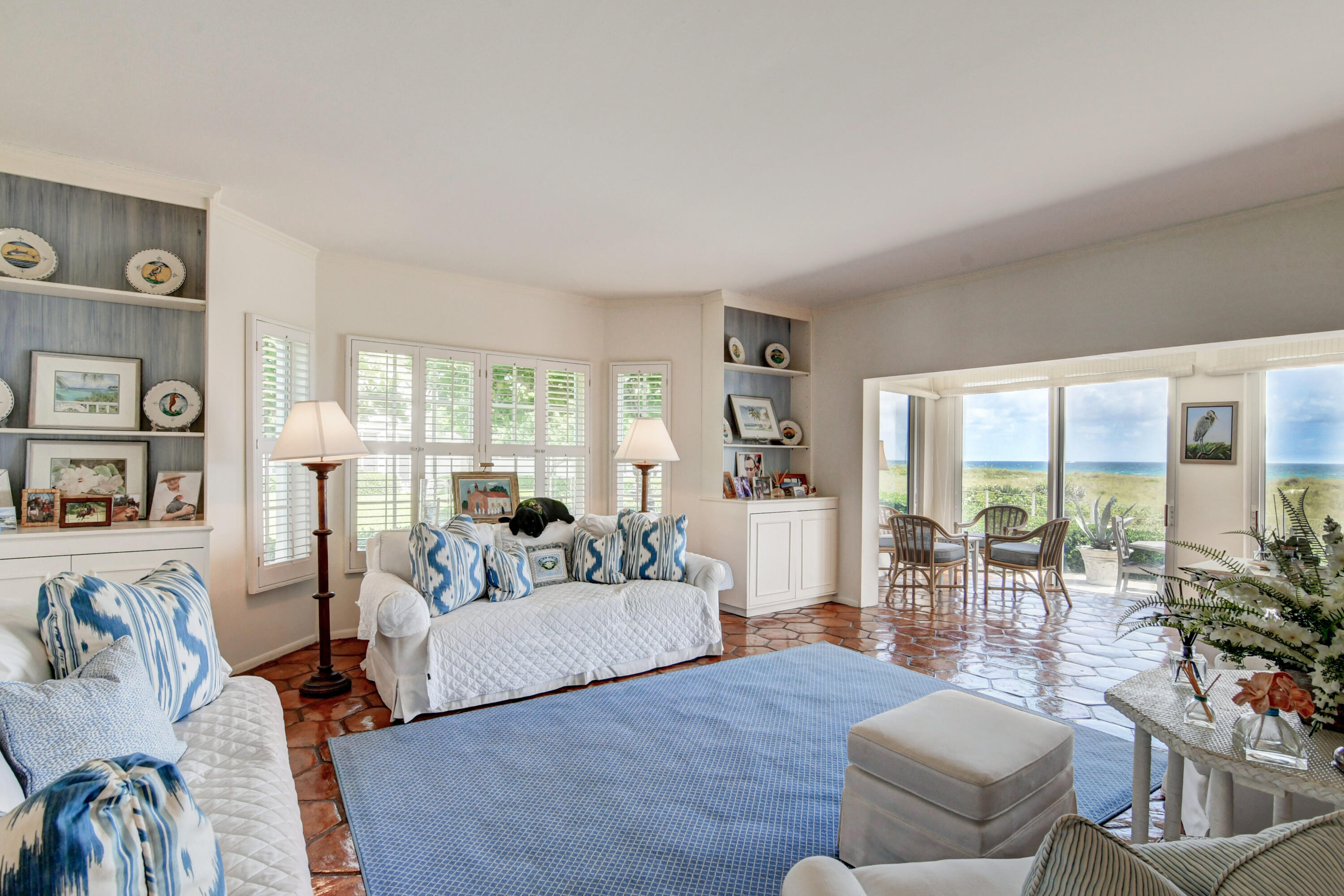 801 North Ocean Boulevard Delray Beach, FL 33483 - Photo 10 of 37 a living room with furniture and a large window