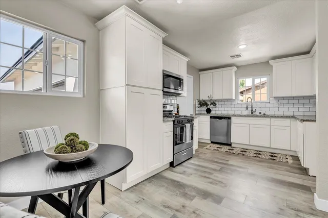a kitchen with a stove and a microwave