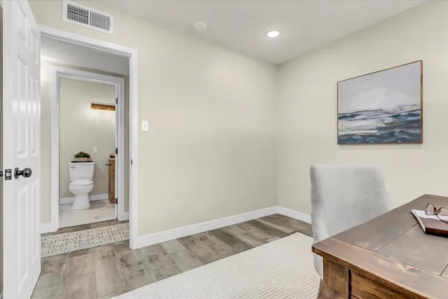 a bedroom with a bed and cabinets