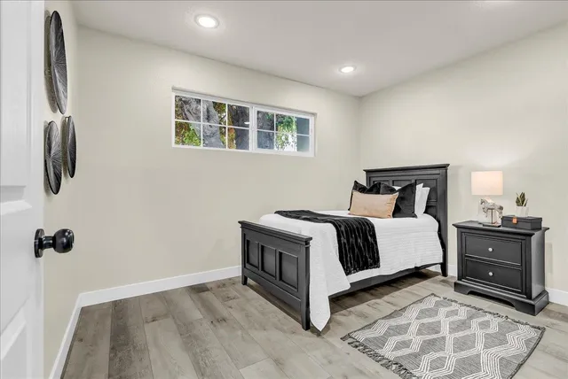a view of a livingroom with furniture and wooden floor