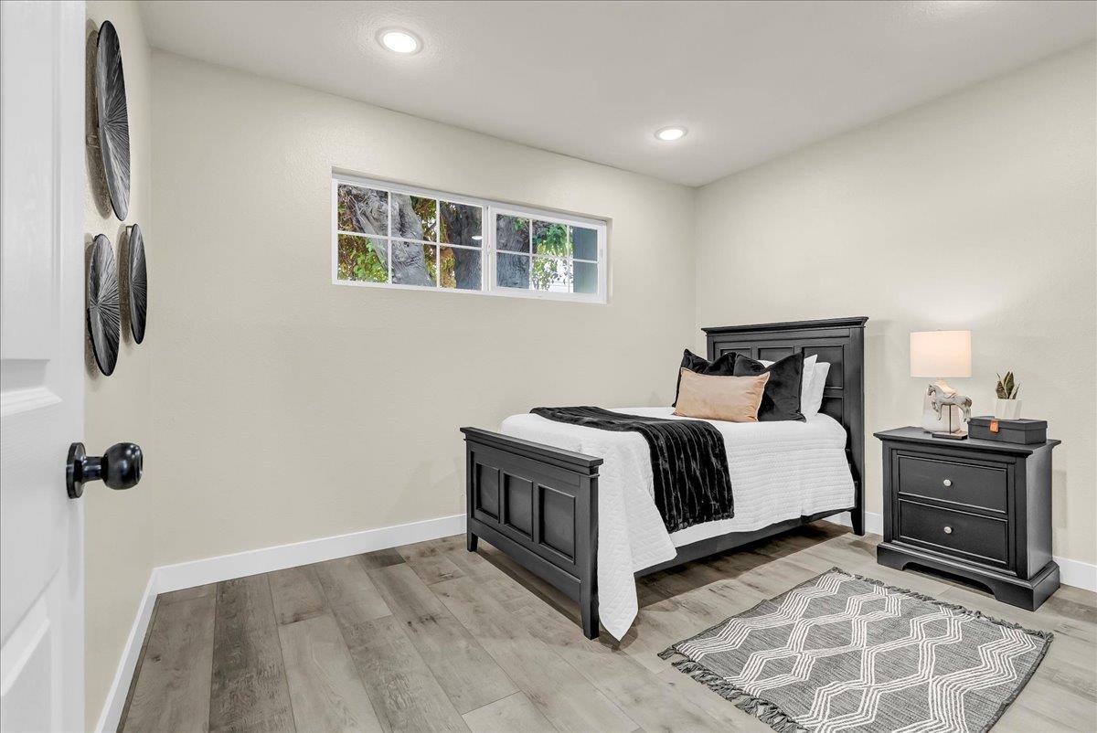 8685 Eddy Street Hanford, CA 93230 - Photo 19 of 45 a bedroom with a bed and cabinets