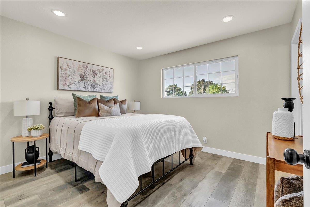 8685 Eddy Street Hanford, CA 93230 - Photo 21 of 45 a bedroom with a bed and painting on the wall