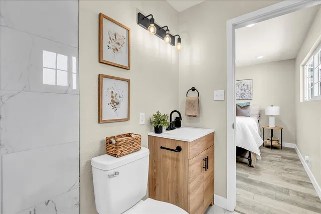 a backyard of a house with table and chairs