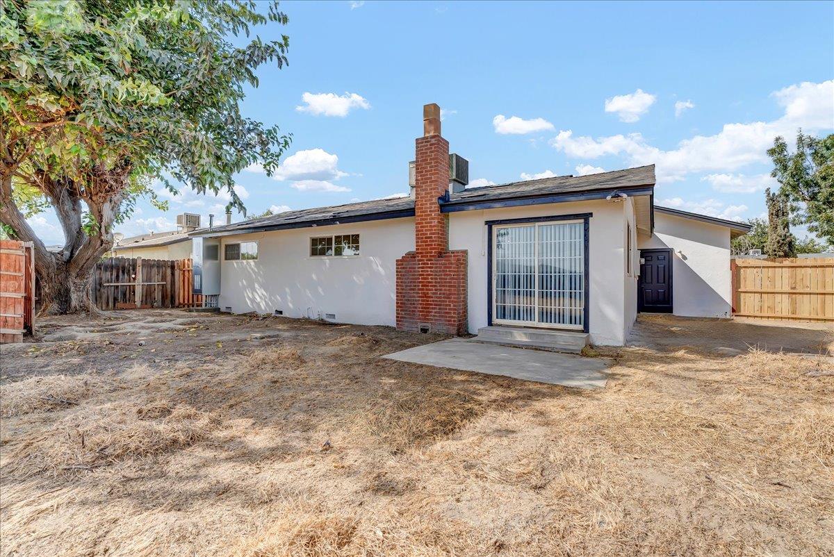 8685 Eddy Street Hanford, CA 93230 - Photo 27 of 45 a view of a house with a yard and garage