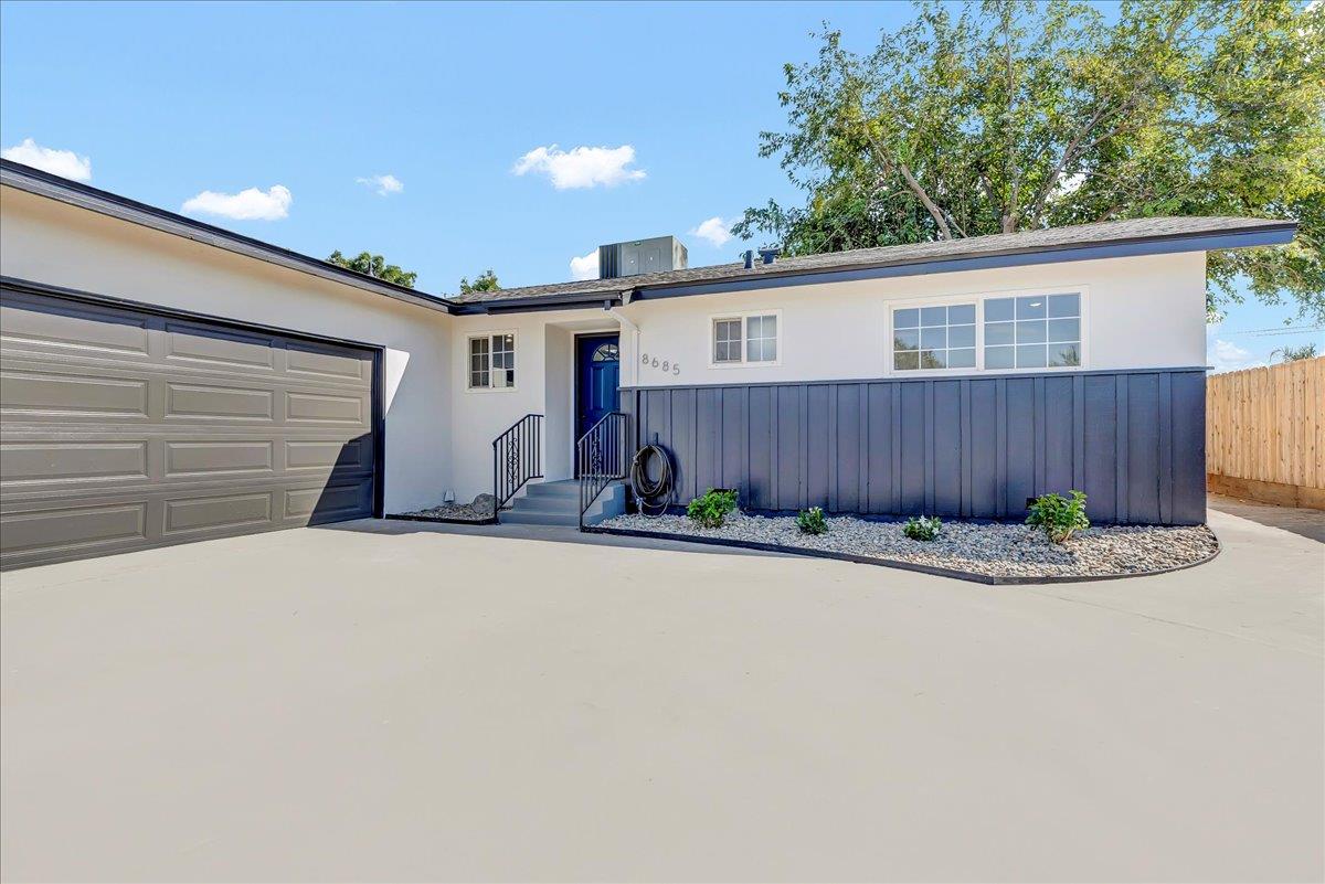 8685 Eddy Street Hanford, CA 93230 - Photo 3 of 45 a front view of a house with garden