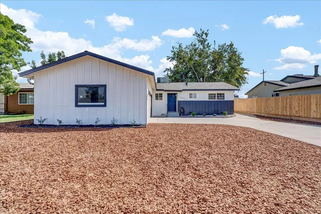 a house view with a backyard space