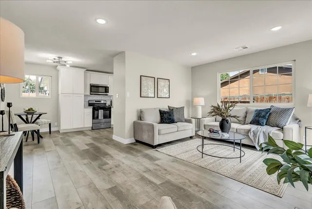 a living room with furniture and a large window
