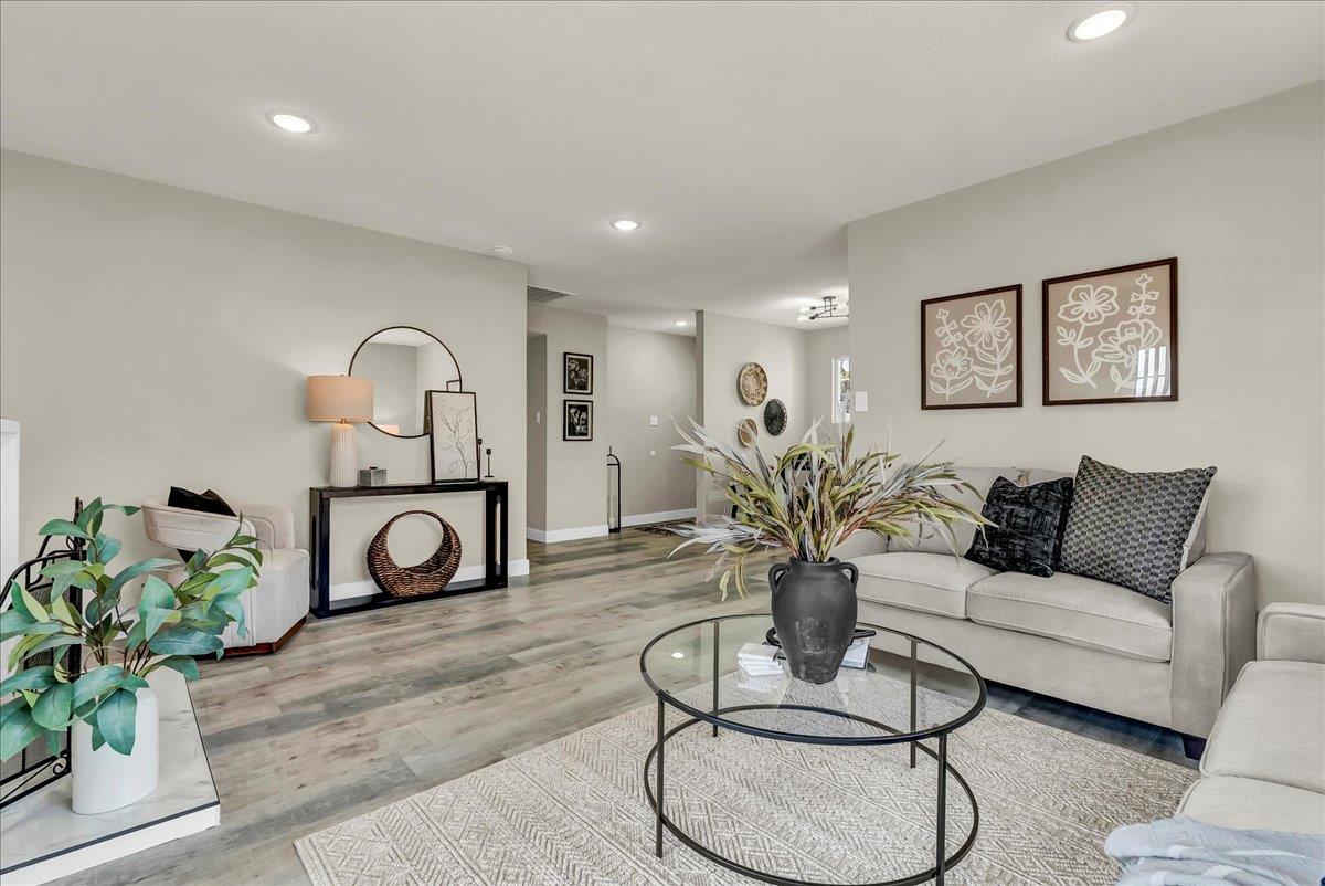 8685 Eddy Street Hanford, CA 93230 - Photo 8 of 45 a living room with furniture a couch and a potted plant