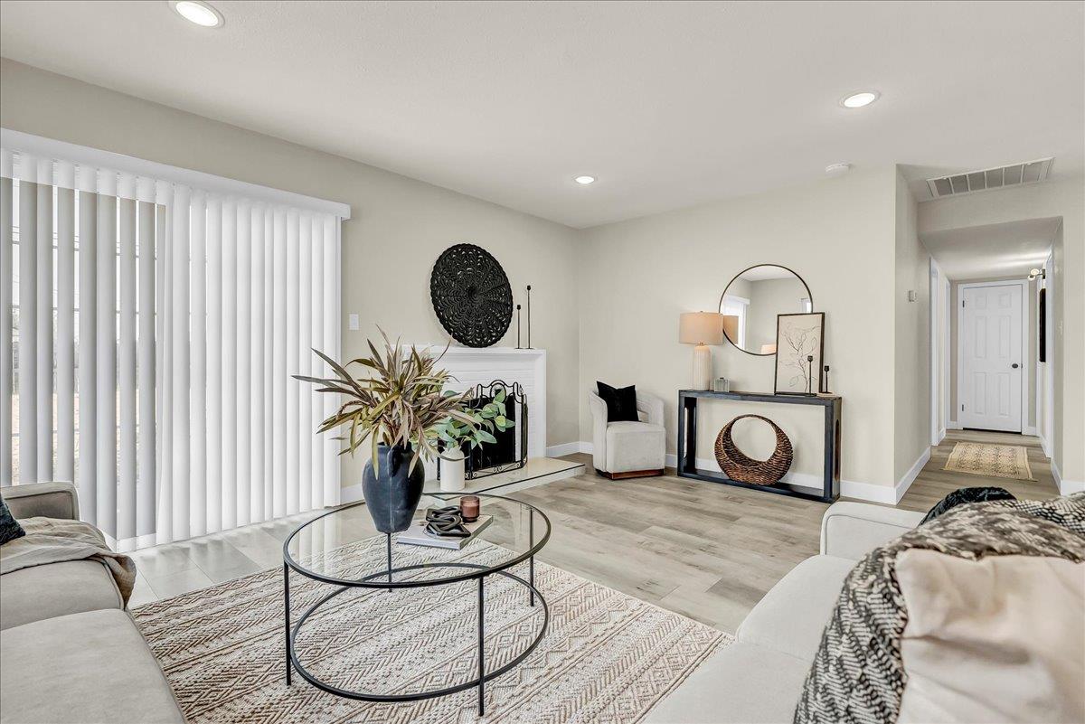 8685 Eddy Street Hanford, CA 93230 - Photo 9 of 45 a living room with furniture a rug and a window