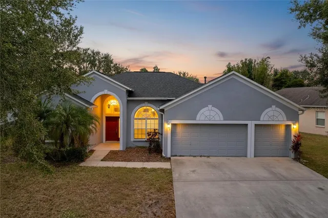 a kitchen with a sink a counter top space stainless steel appliances cabinets and a counter top space
