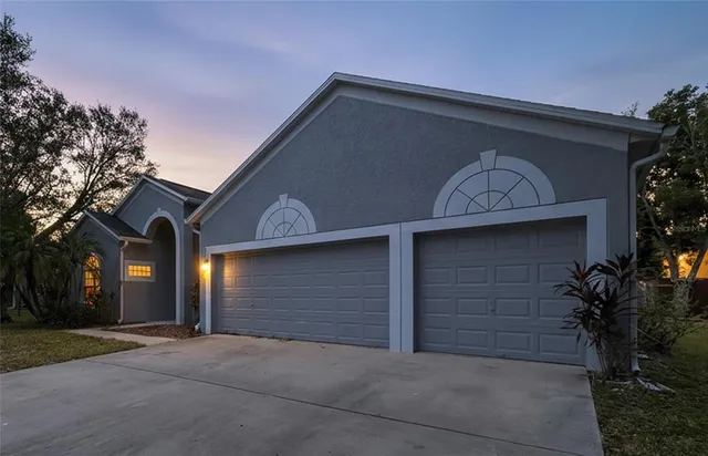 a large kitchen with stainless steel appliances lots of counter top space and cabinets