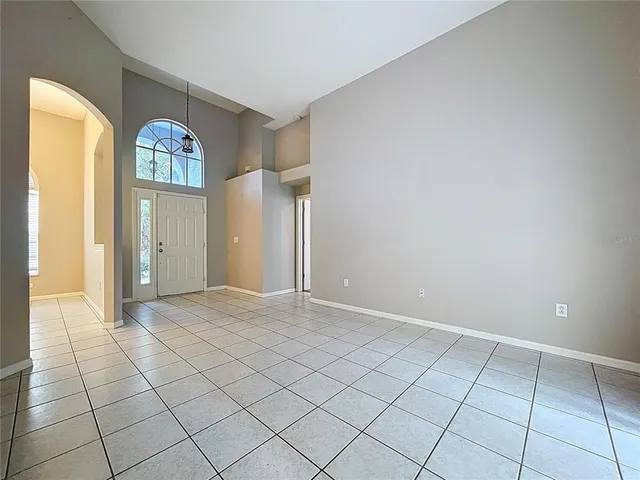 a kitchen with white cabinets and appliances