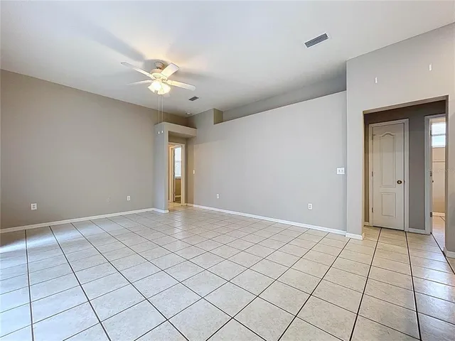 a backyard of a house with yard and trampoline