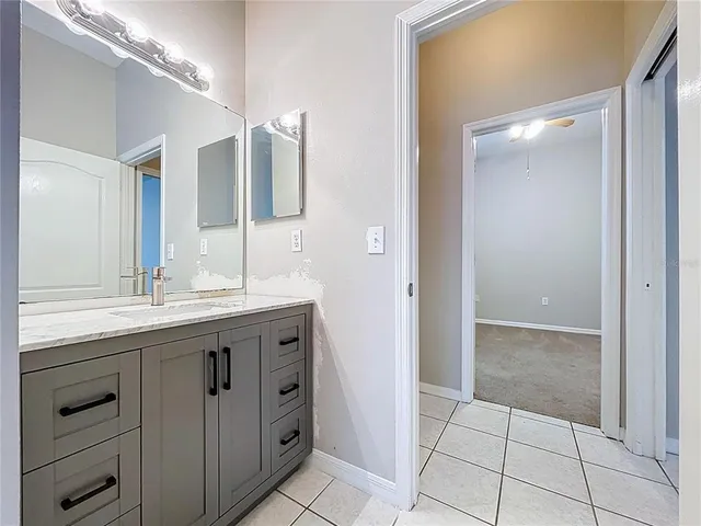 a view of a house with a yard and garage