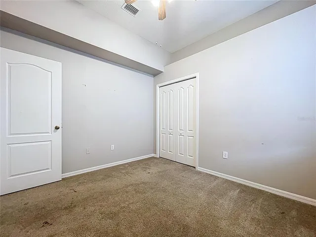 an aerial view of lake and residential houses with outdoor space