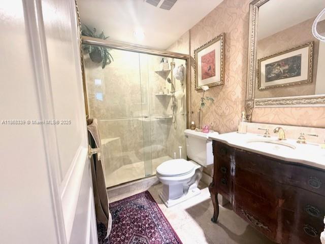 1408 Brickell Bay Drive, Unit 303 Miami, FL 33131 - Photo 11 of 24 a bathroom with a sink toilet a mirror and shower