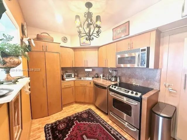 a kitchen with a stove and a sink
