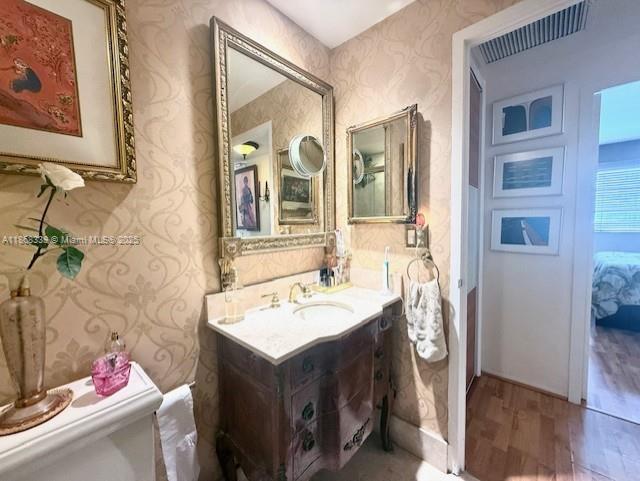 1408 Brickell Bay Drive, Unit 303 Miami, FL 33131 - Photo 10 of 24 a bathroom with a sink and a mirror
