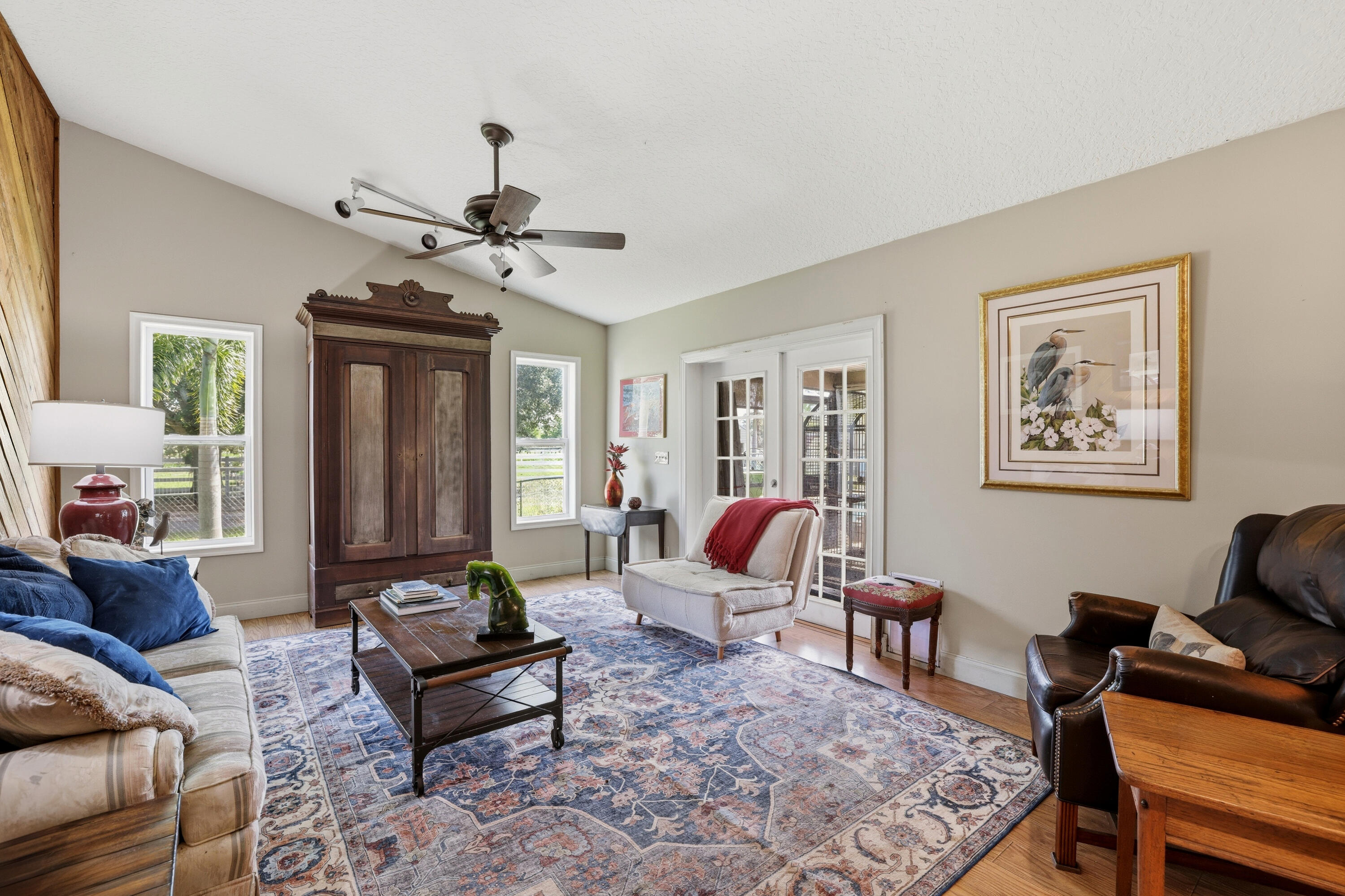 14095 Biddex Road Loxahatchee Groves, FL 33470 - Photo 10 of 69 a living room with furniture a rug and a window