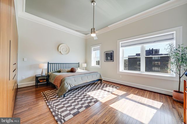 a bedroom with bed and a window