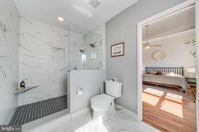 a bedroom with bed and a table