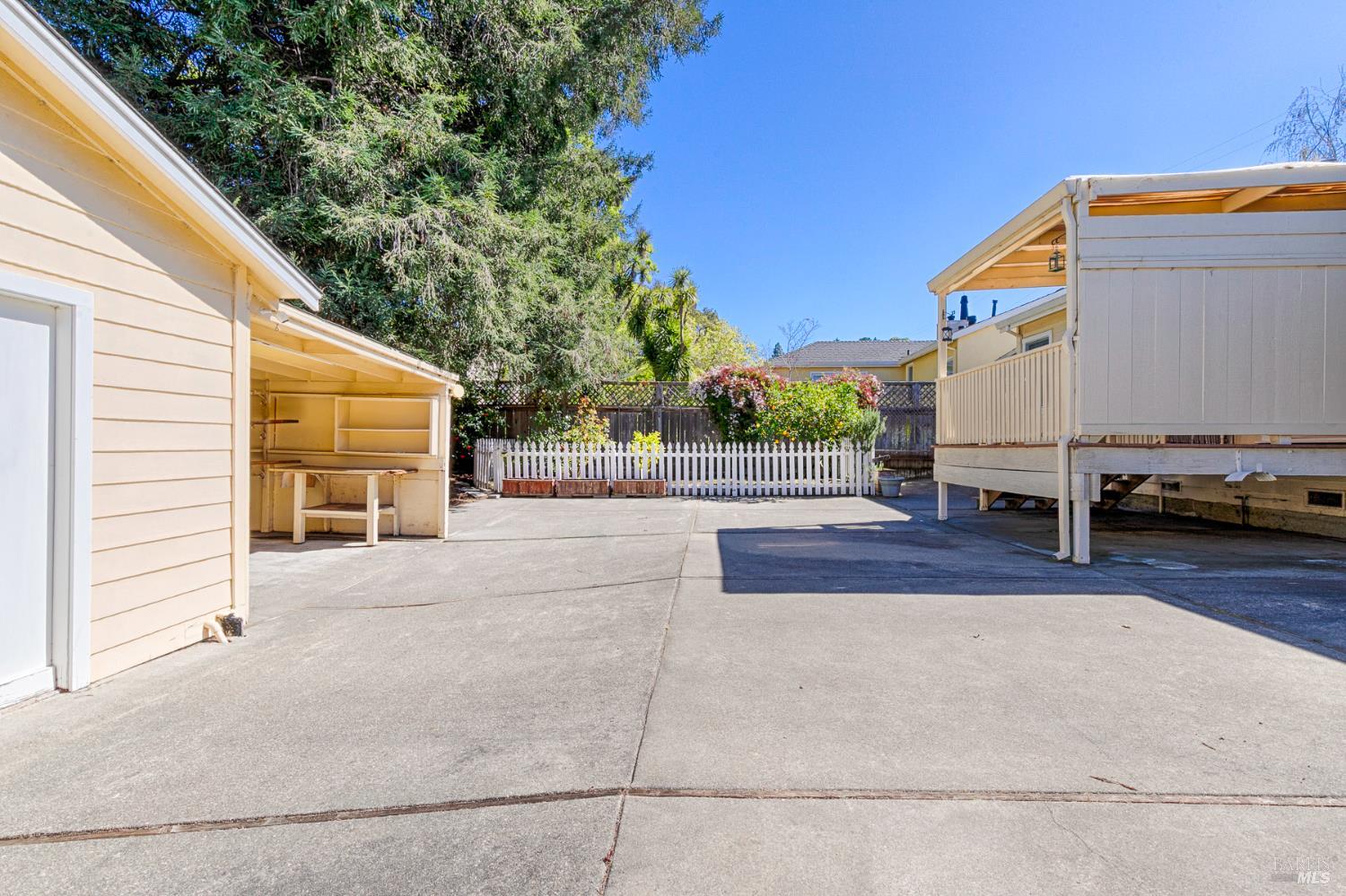 41 Meadow Avenue San Rafael, CA 94901 - Photo 40 of 55 From this view you can see the workshop and carport on the left, the deck off the back of the house on the right and fenced garden area straight ahead.