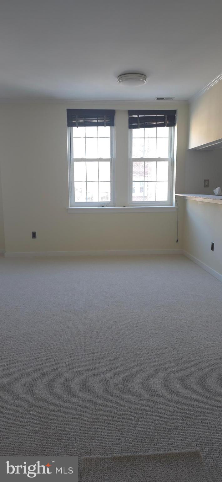 104 Woodside Road, Unit A203 Haverford, PA 19041 - Photo 5 of 22 an empty room with a window