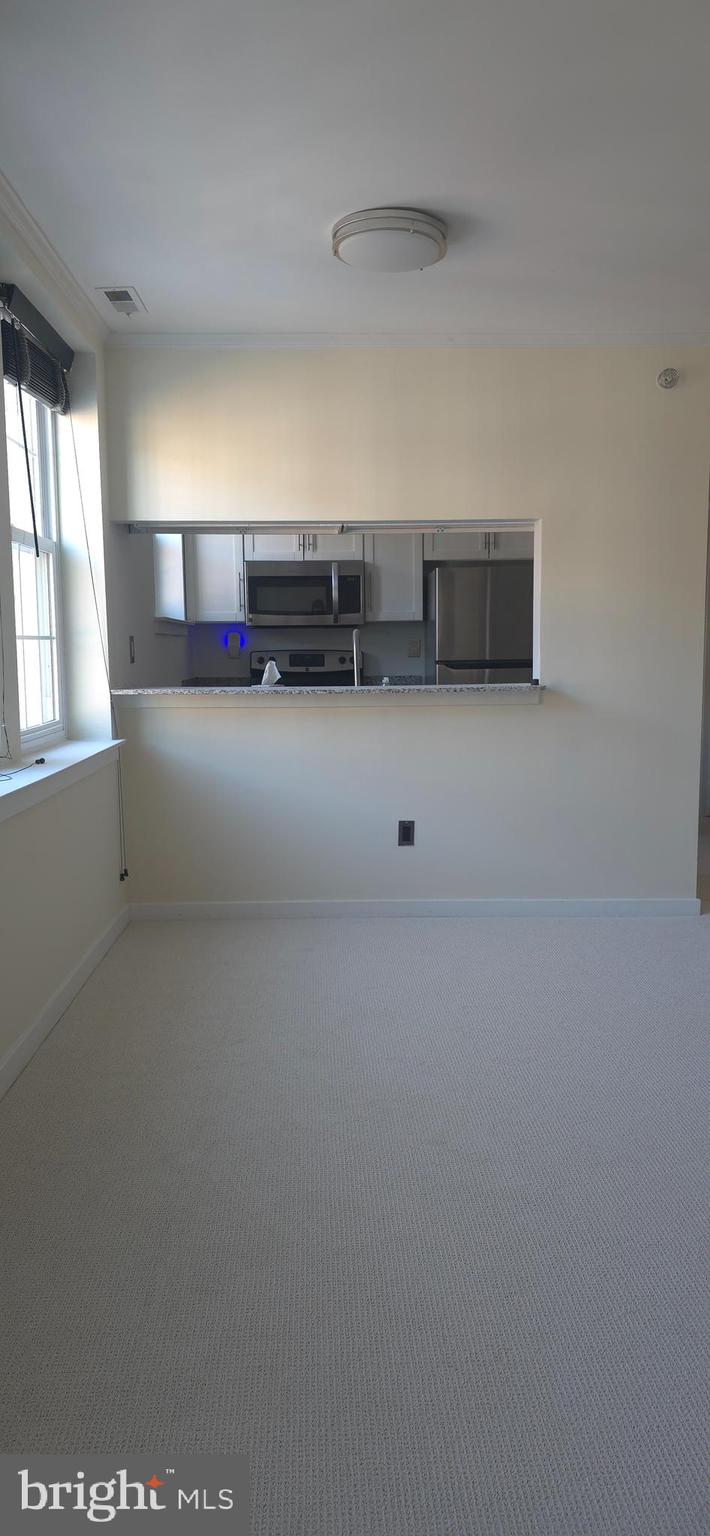 104 Woodside Road, Unit A203 Haverford, PA 19041 - Photo 8 of 22 a view of empty room with windows