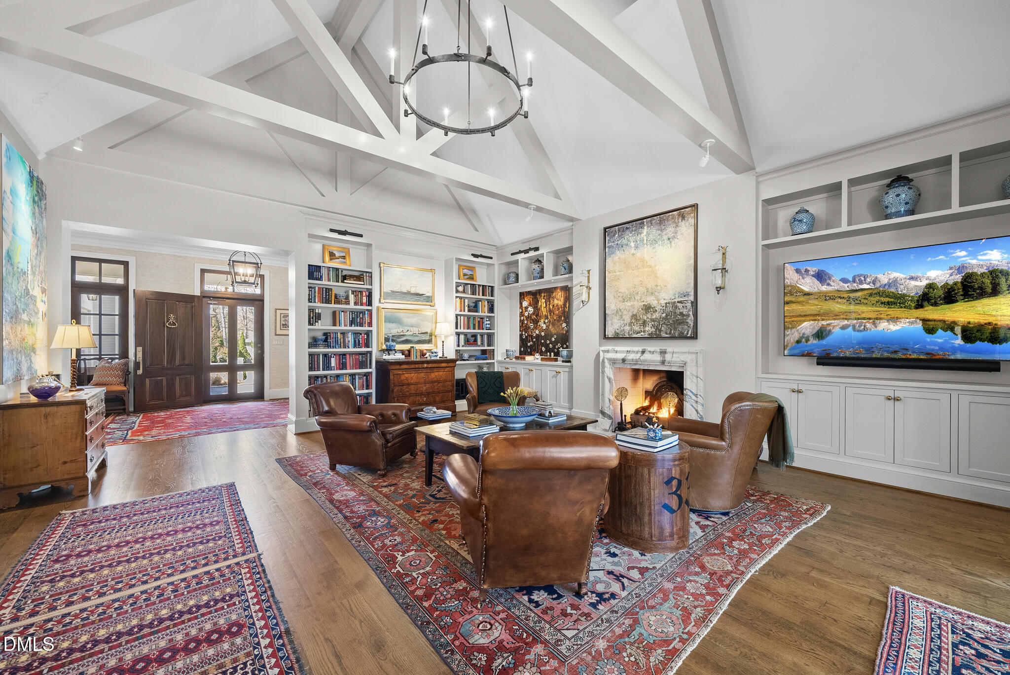 1312 Duplin Road Raleigh, NC 27607 - Photo 18 of 90 a living room with furniture a rug and a flat screen tv
