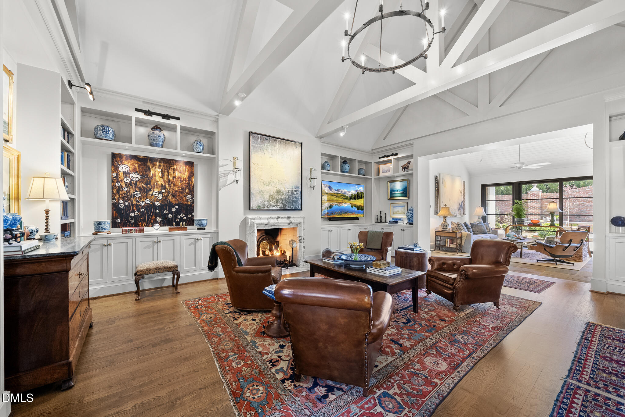 1312 Duplin Road Raleigh, NC 27607 - Photo 20 of 90 a living room with fireplace furniture and a flat screen tv