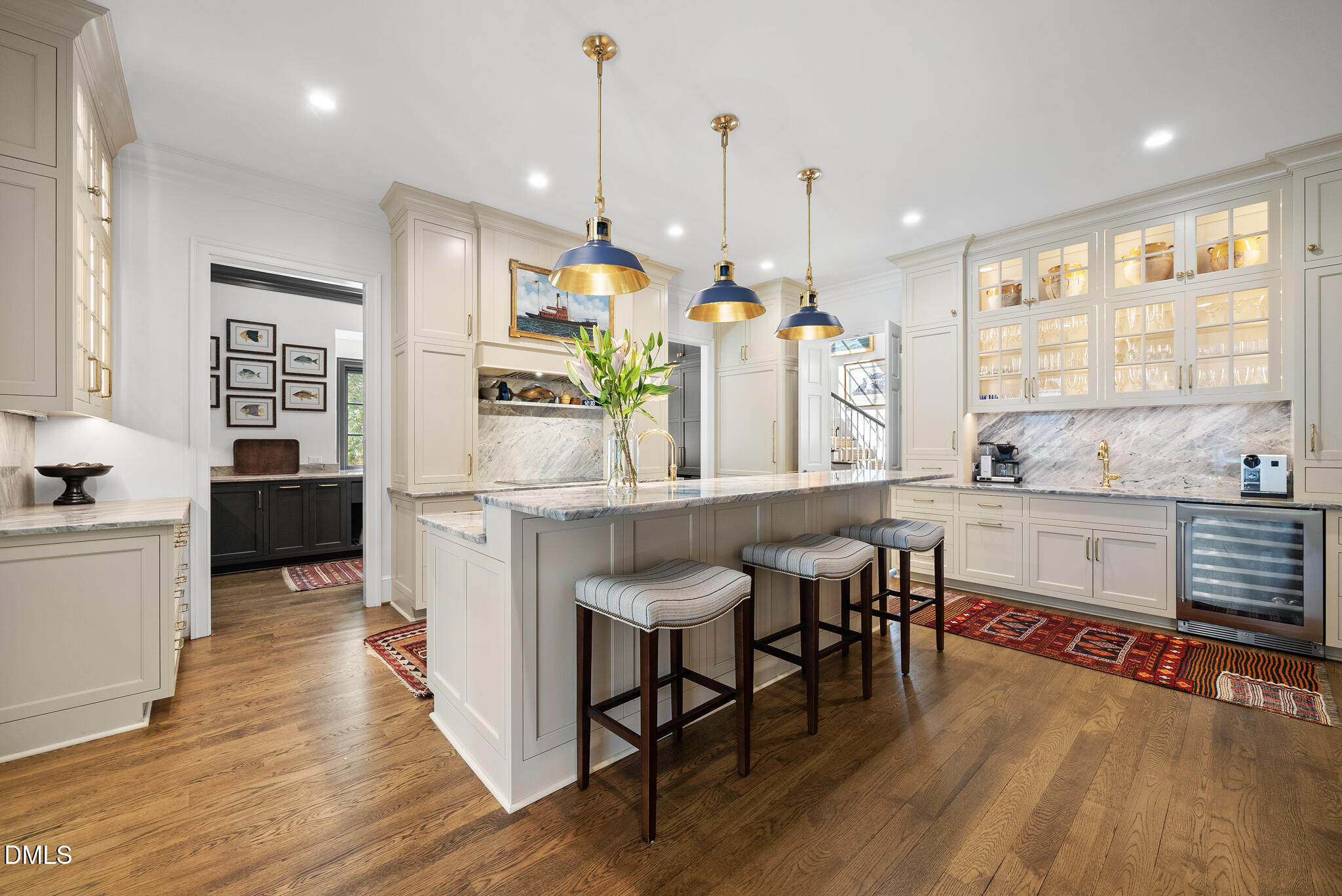 1312 Duplin Road Raleigh, NC 27607 - Photo 22 of 90 a kitchen with stainless steel appliances kitchen island granite countertop a stove a sink and a wooden floors