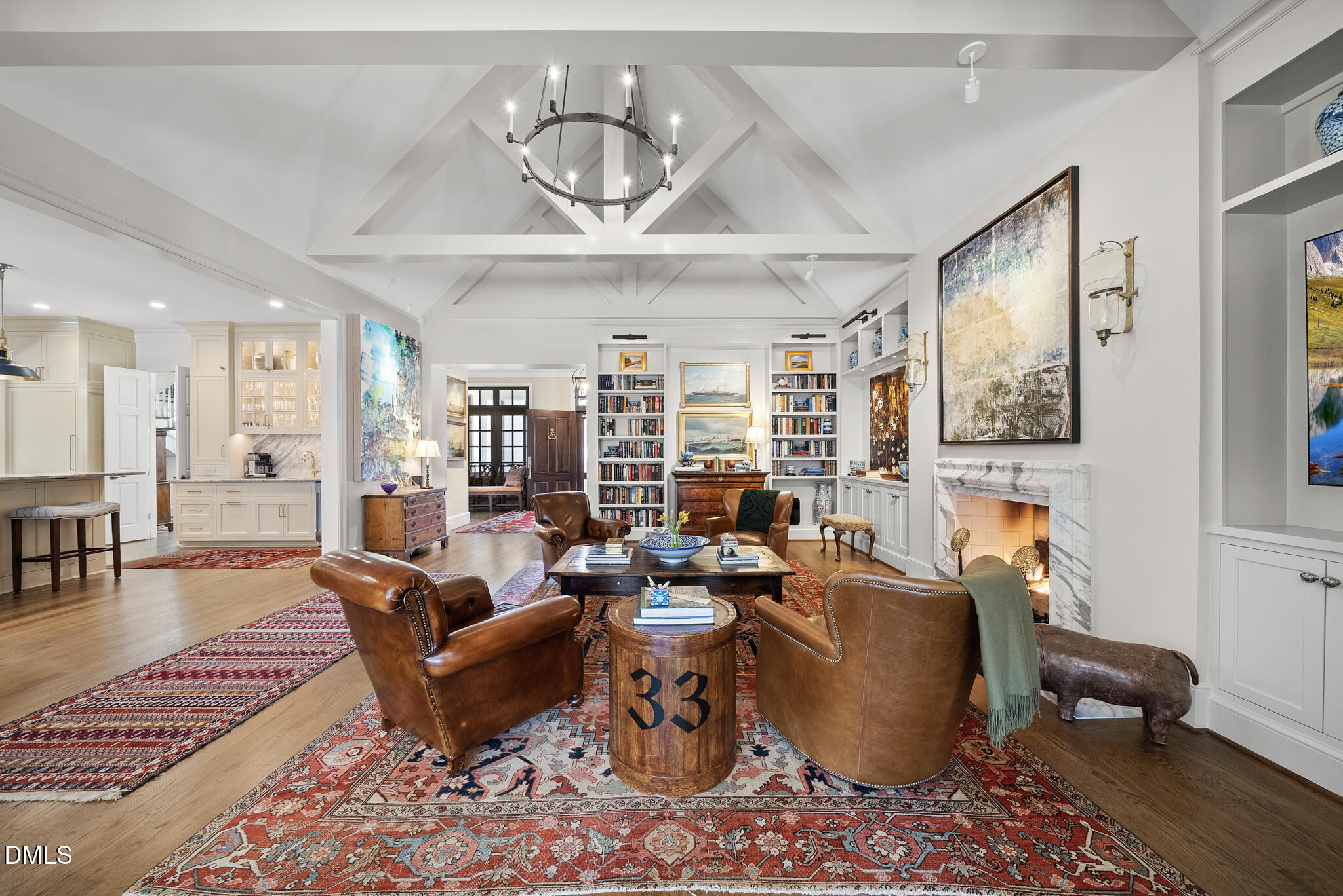 1312 Duplin Road Raleigh, NC 27607 - Photo 33 of 90 a living room with furniture wooden floor and a chandelier
