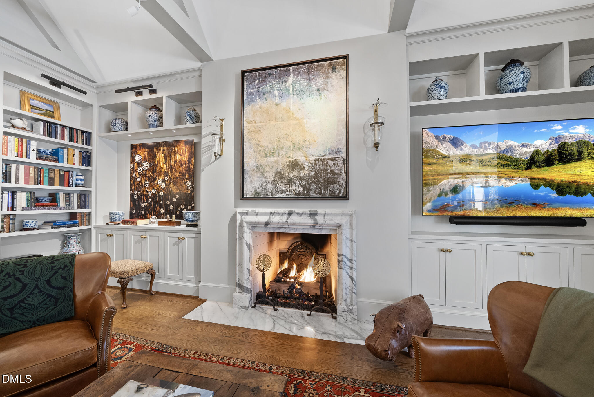 1312 Duplin Road Raleigh, NC 27607 - Photo 34 of 90 a living room with furniture a fireplace and a flat screen tv
