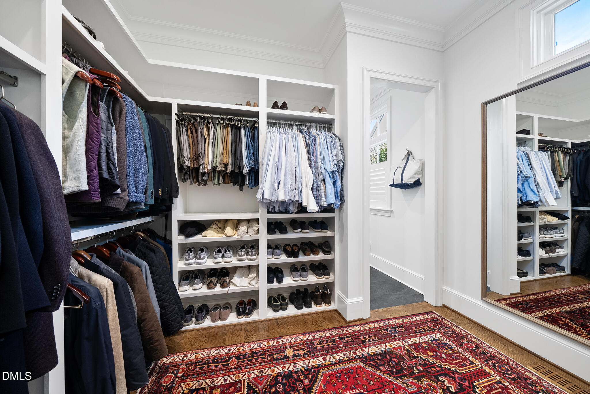 1312 Duplin Road Raleigh, NC 27607 - Photo 41 of 90 a view of walk in closet with clothes and shoes
