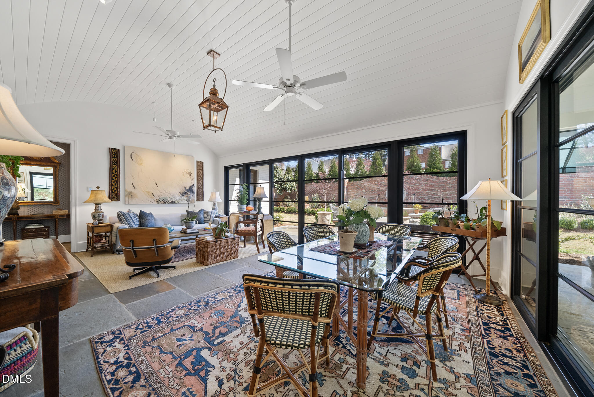 1312 Duplin Road Raleigh, NC 27607 - Photo 43 of 90 a living room with furniture and a floor to ceiling window