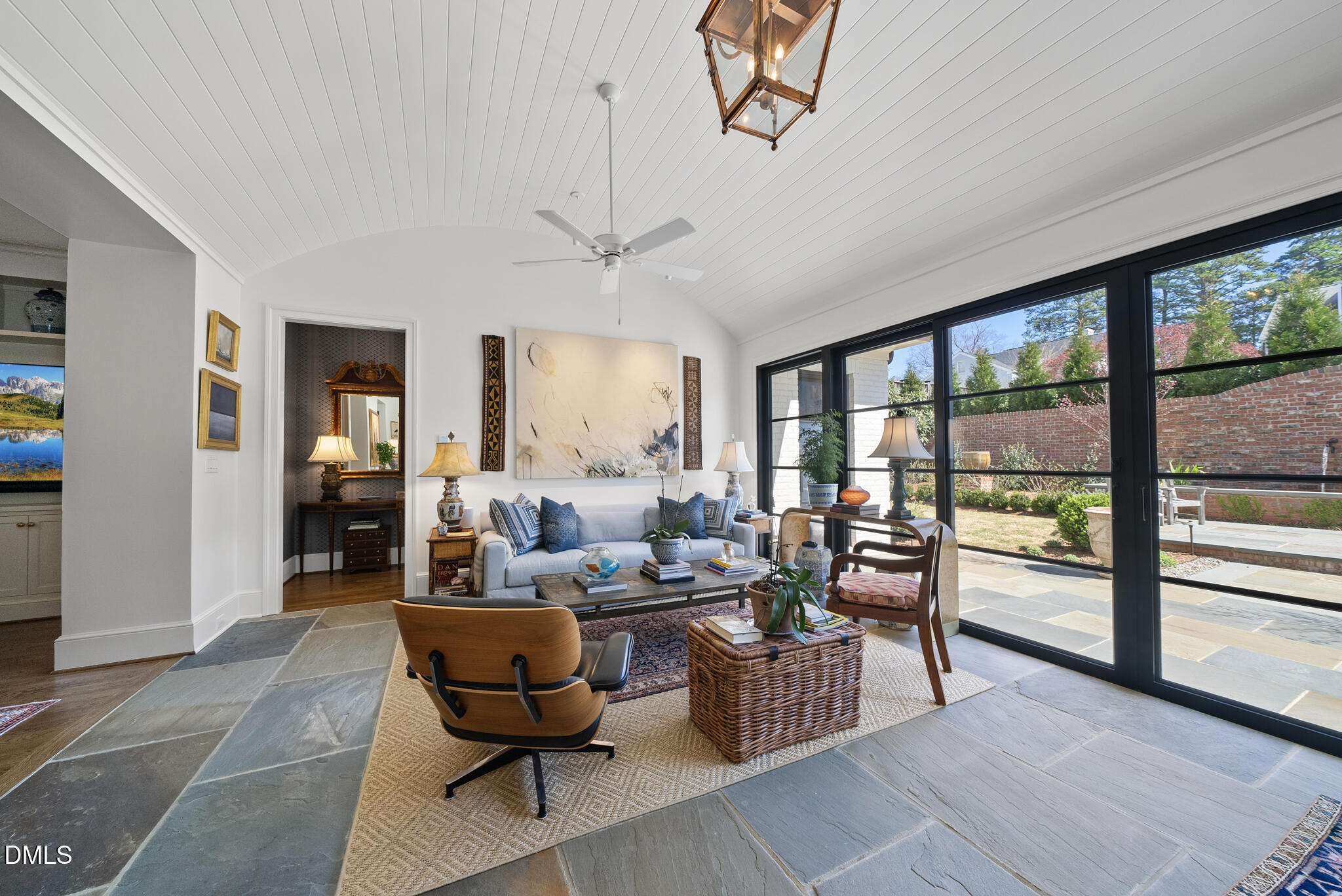 1312 Duplin Road Raleigh, NC 27607 - Photo 46 of 90 a living room with furniture and a floor to ceiling window