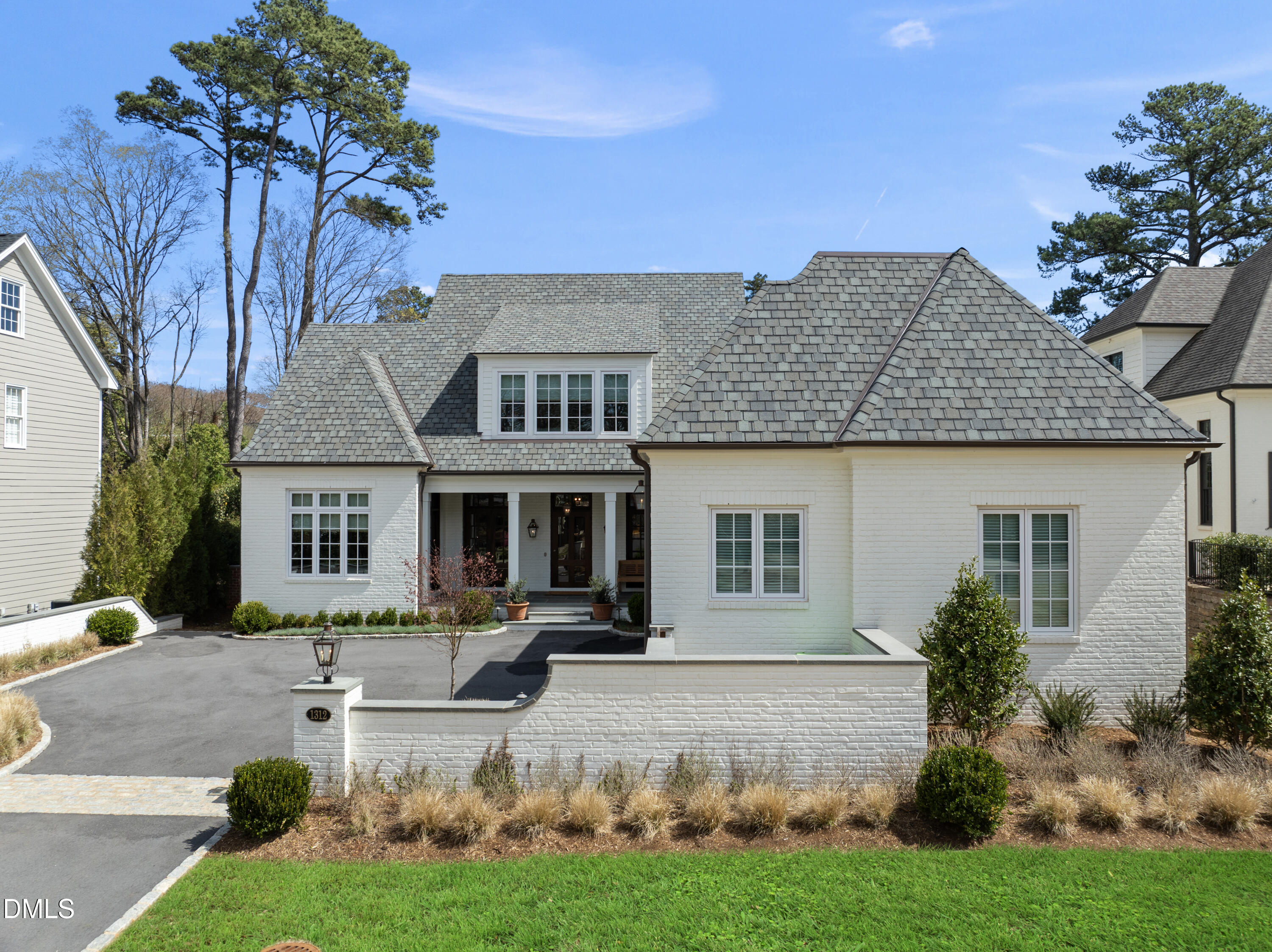 1312 Duplin Road Raleigh, NC 27607 - Photo 5 of 90 a front view of a house with a yard