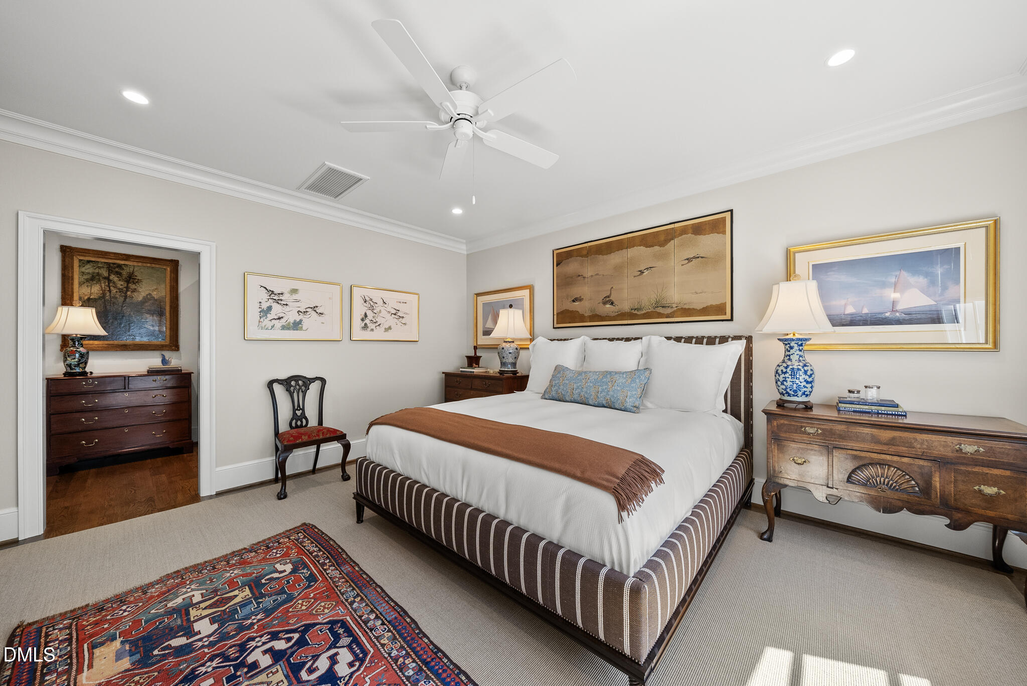 1312 Duplin Road Raleigh, NC 27607 - Photo 58 of 90 a bedroom with a bed and a lamp on a dresser