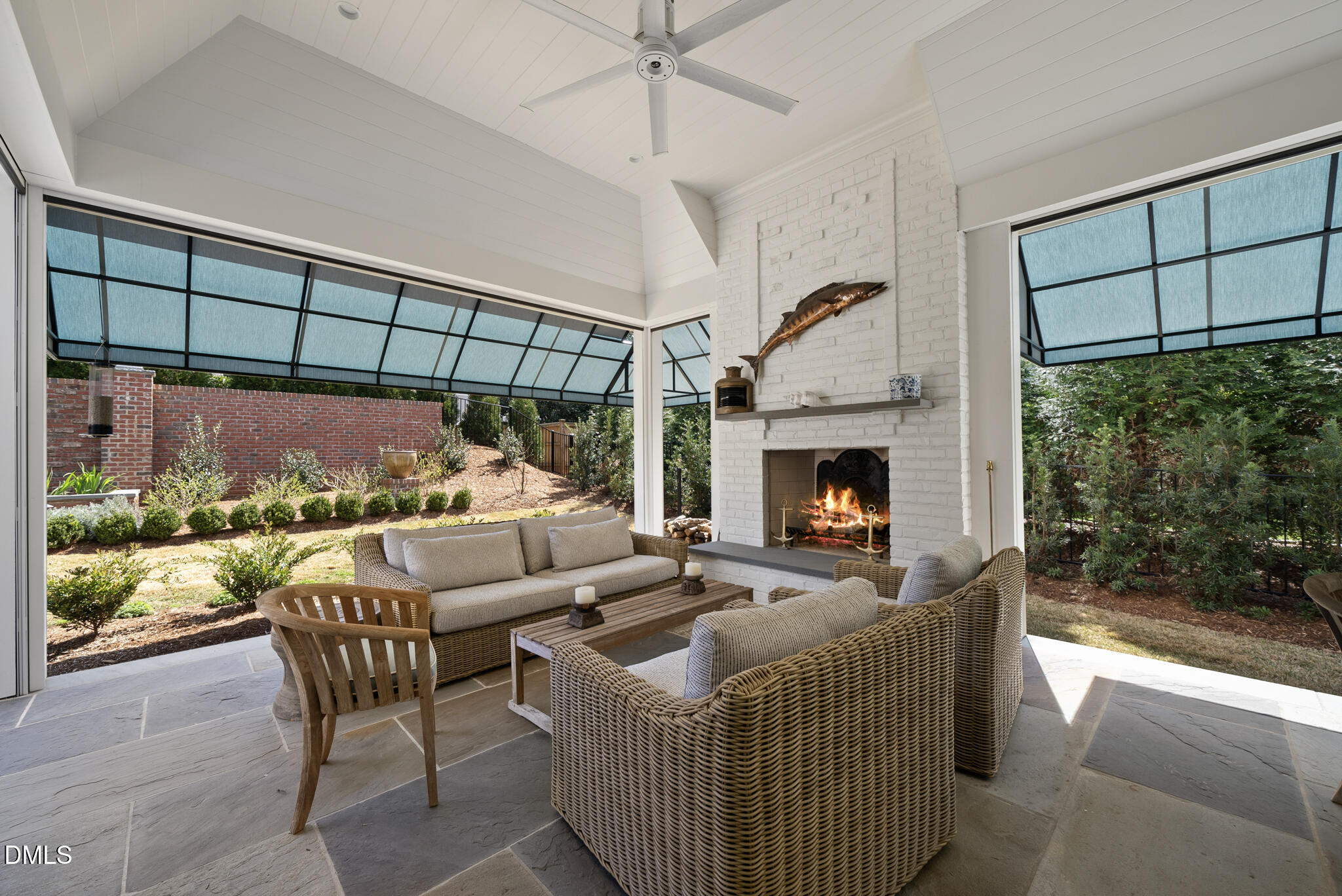 1312 Duplin Road Raleigh, NC 27607 - Photo 67 of 90 a living room with furniture a fireplace and a flat screen tv