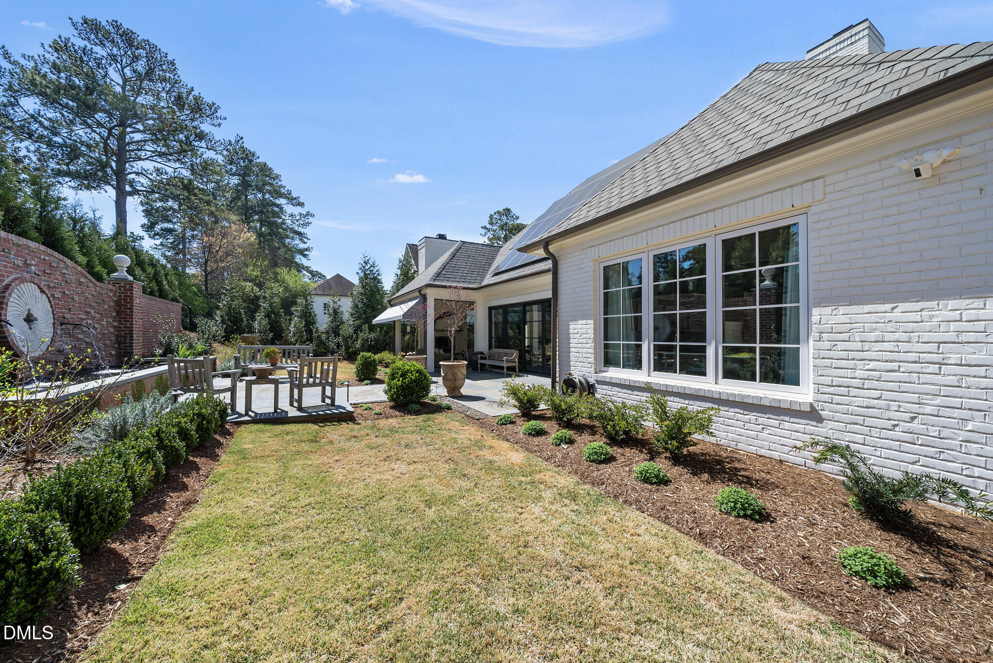 1312 Duplin Road Raleigh, NC 27607 - Photo 75 of 90 a front view of a house with sitting area and garden