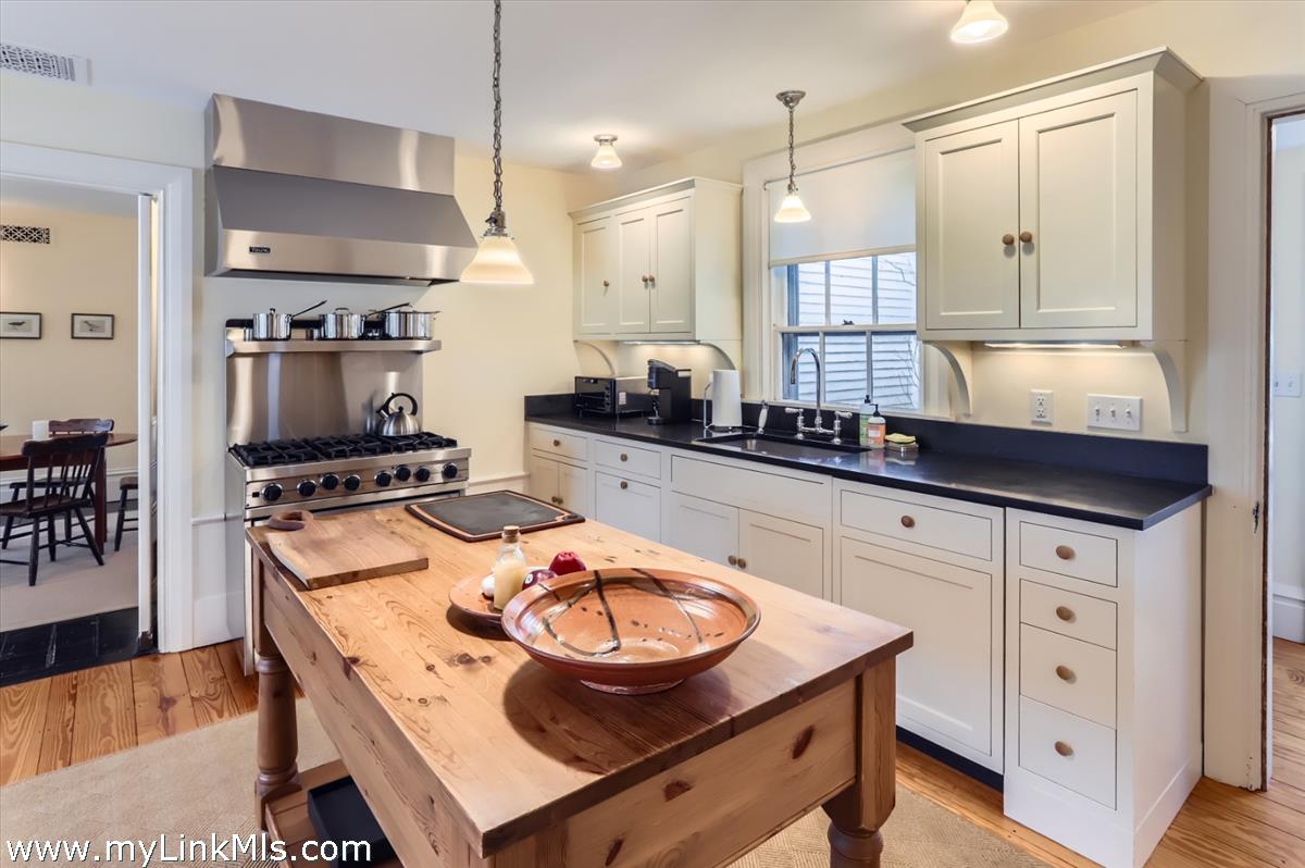 27 Spring Street Vineyard Haven, MA 02568 - Photo 13 of 58 a kitchen with stainless steel appliances a stove a sink and a refrigerator