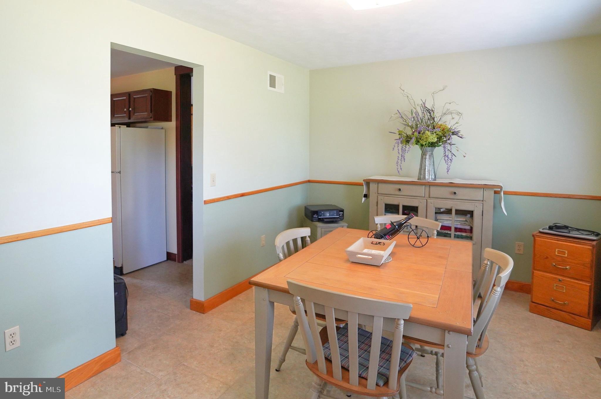 245 Montclair Road Gettysburg, PA 17325 - Photo 13 of 32 a table and chairs in a room
