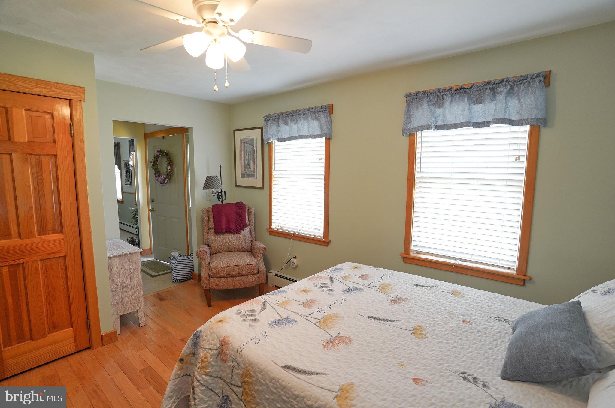245 Montclair Road Gettysburg, PA 17325 - Photo 18 of 32 a bedroom with a bed and a chandelier