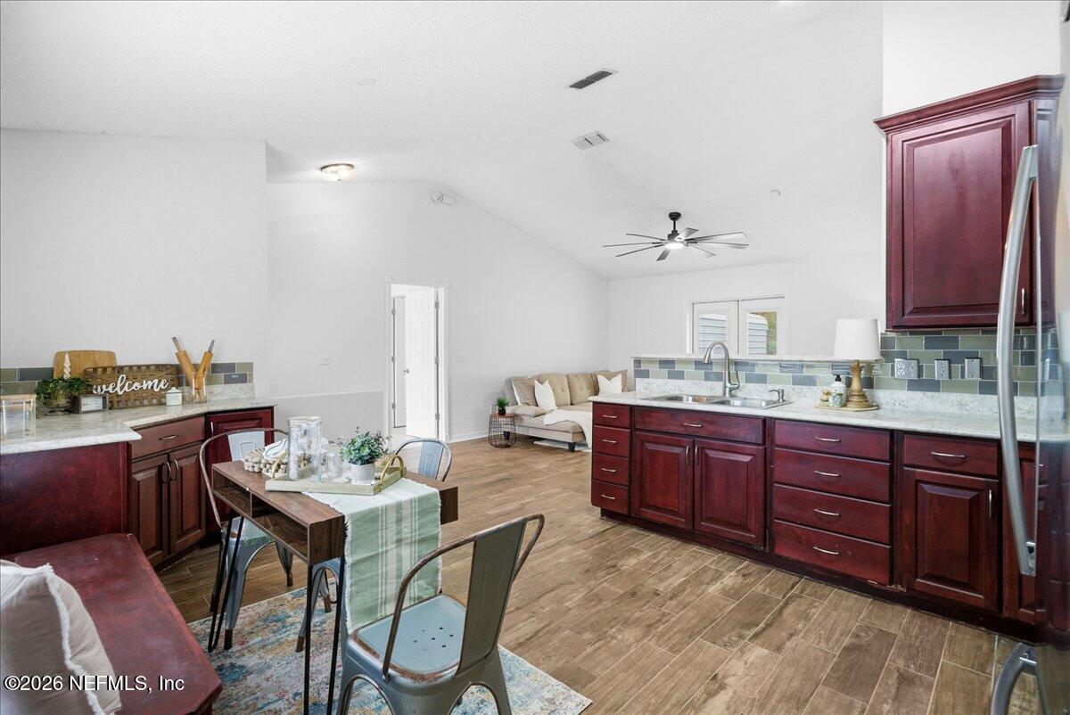 425 3rd Street West Baldwin, FL 32234 - Photo 12 of 47 a room with a granite countertop sink and cabinets
