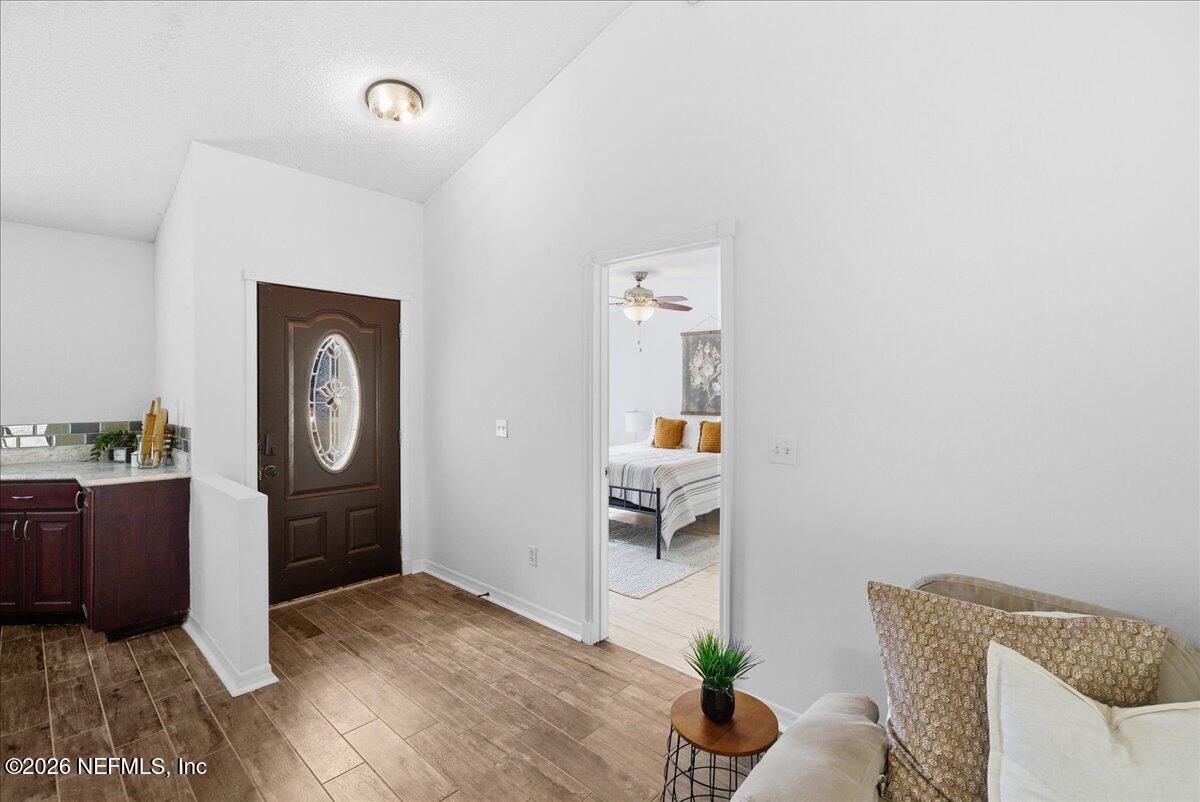 425 3rd Street West Baldwin, FL 32234 - Photo 14 of 47 a view of workspace with furniture and wooden floor