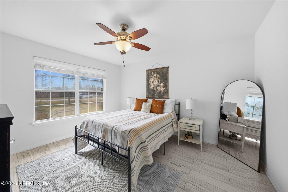 425 3rd Street West Baldwin, FL 32234 - Photo 15 of 47 a bedroom with a bed and a window