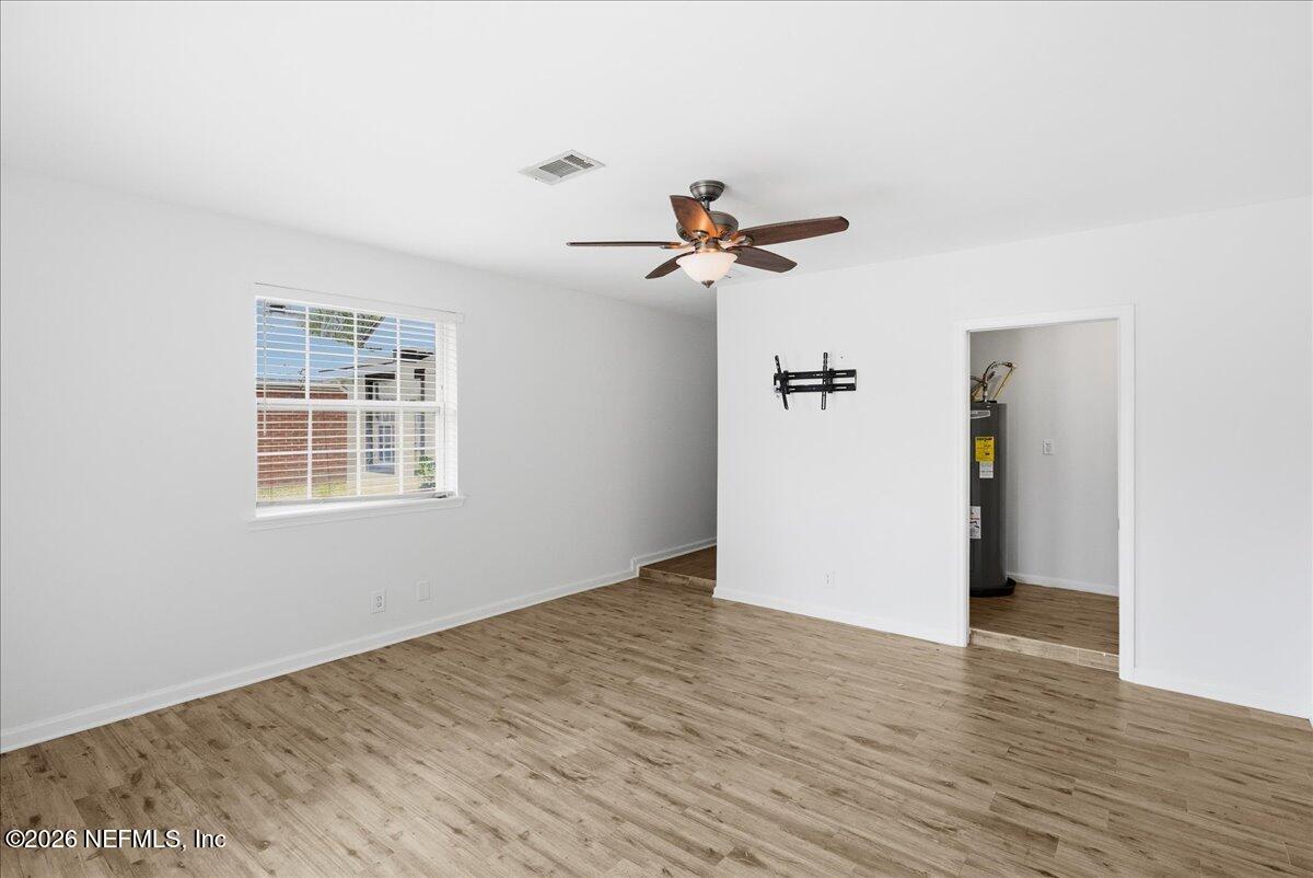 425 3rd Street West Baldwin, FL 32234 - Photo 27 of 47 a view of an empty room with wooden floor