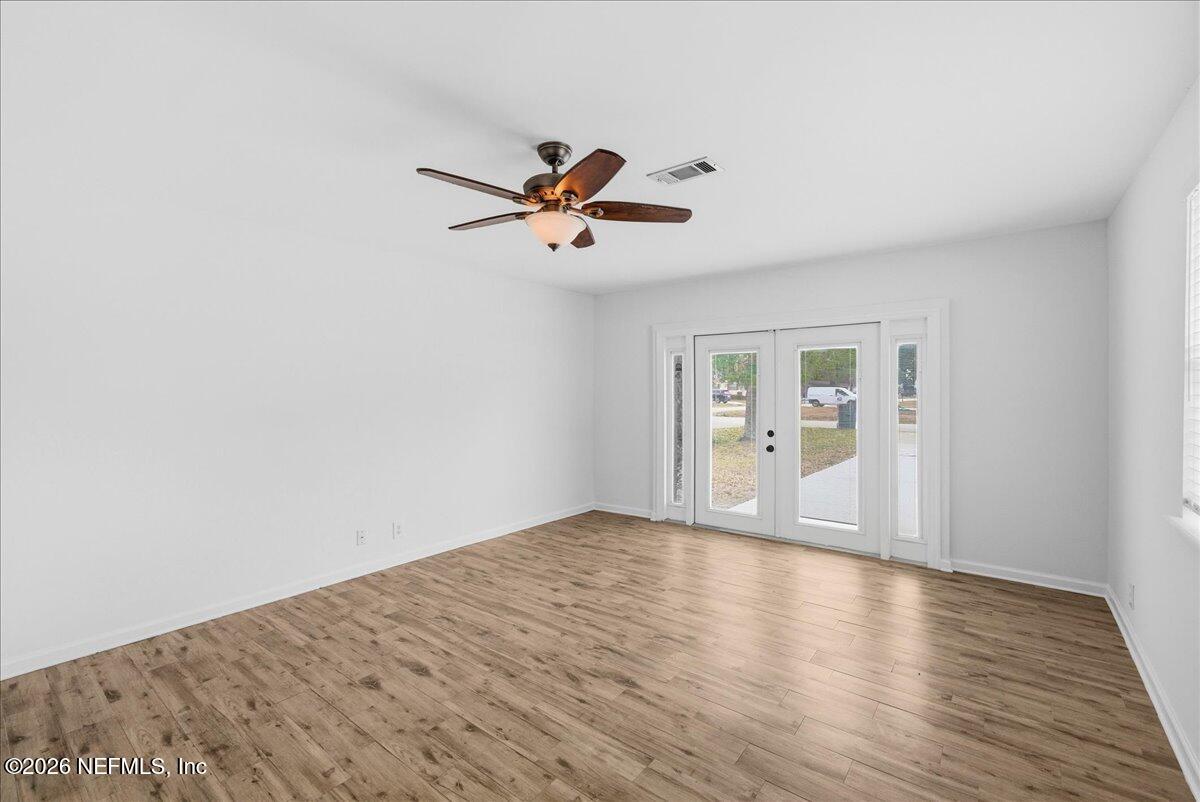 425 3rd Street West Baldwin, FL 32234 - Photo 28 of 47 a view of empty room with wooden floor