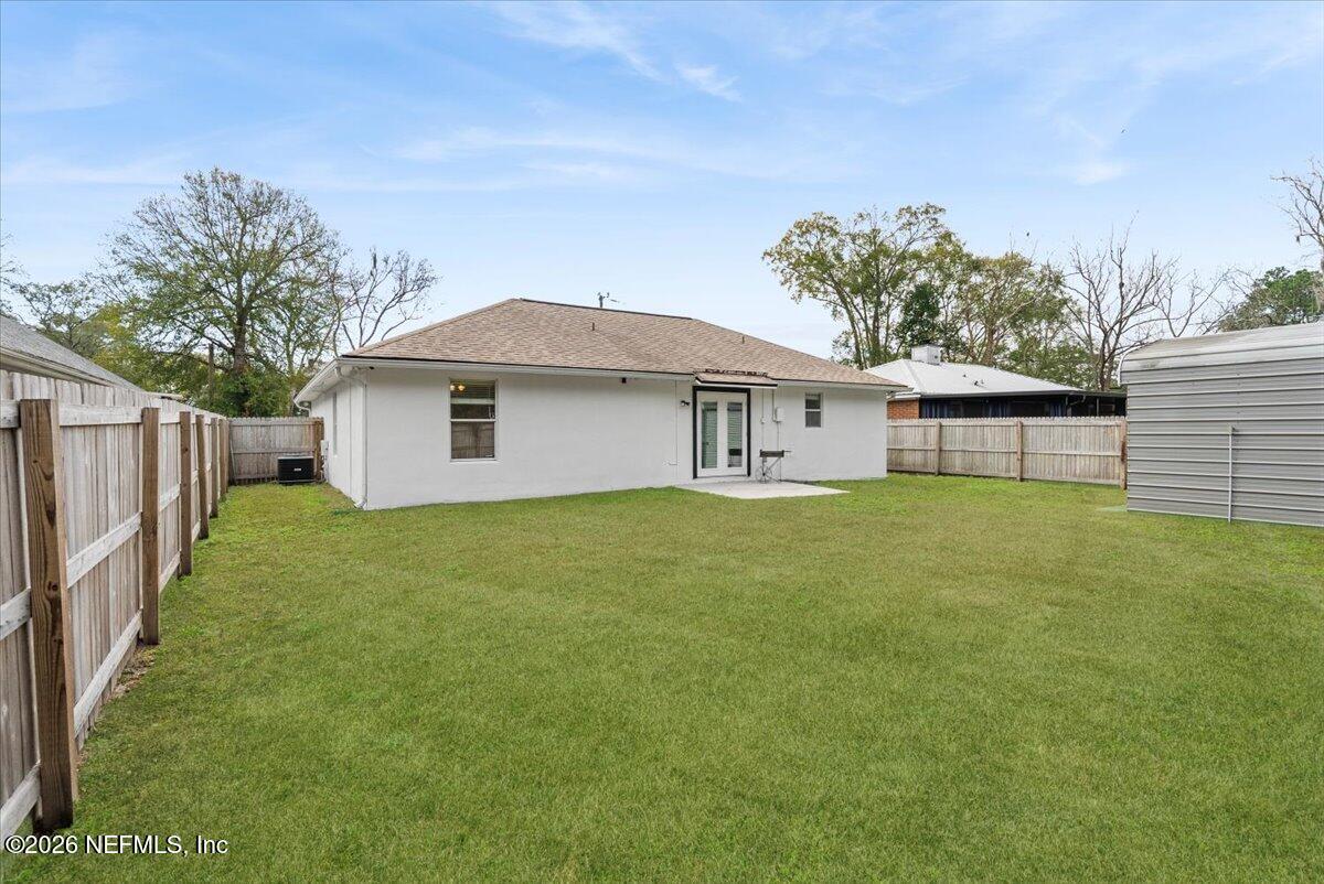 425 3rd Street West Baldwin, FL 32234 - Photo 30 of 47 a front view of a house with a garden